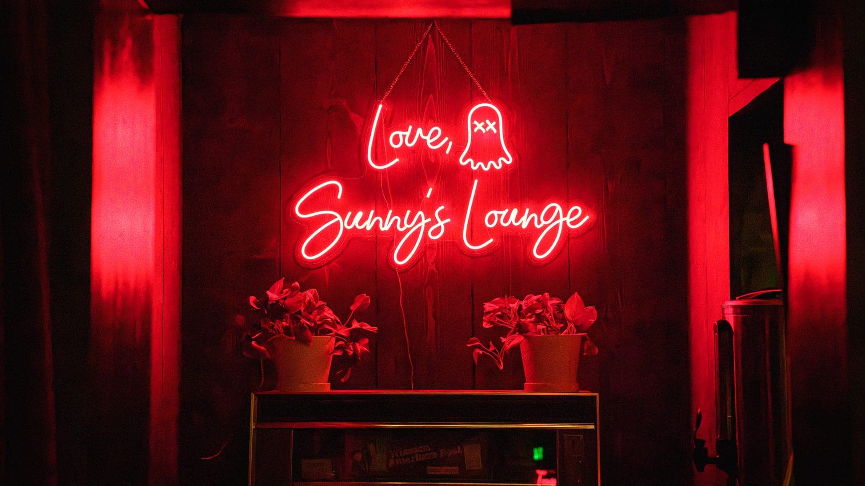 Neon 'Love, Sunny's Lounge' sign inside Sunny's Lounge in Phoenix — one of two Arizona bars named to USA TODAY's 2026 Bars of the Year.