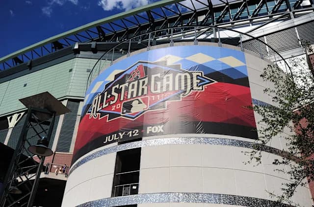 An MLB All-Star Game banner displayed on the exterior of a stadium — a reminder of the looming July All-Star break as the Arizona Diamondbacks try to turn their season around before the midseason pause.