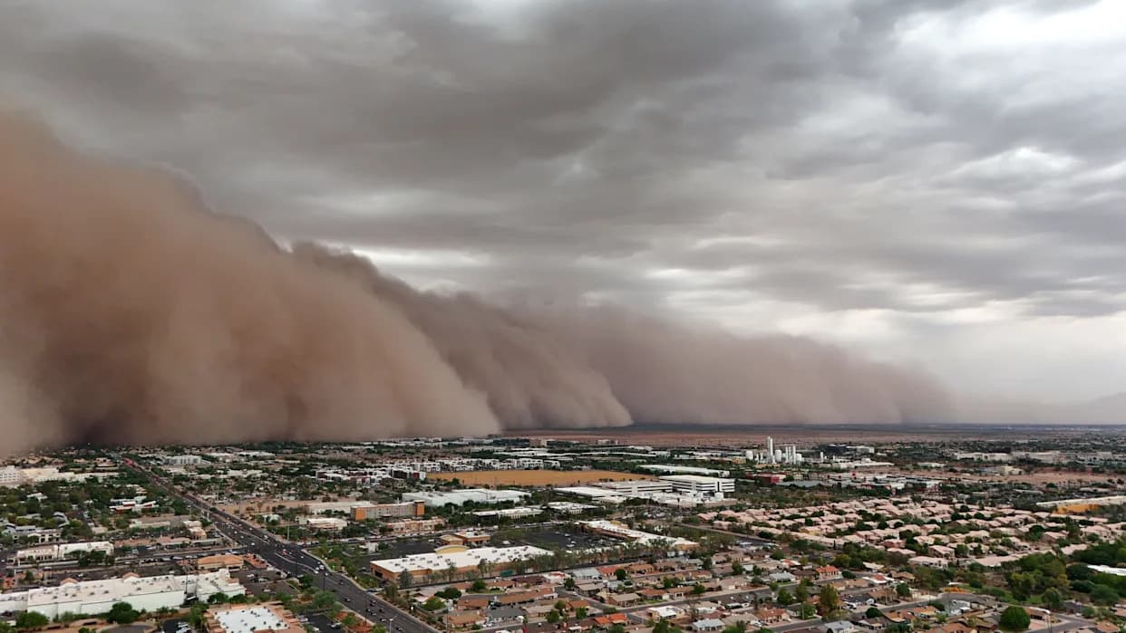 A sweeping dust front moves across an Arizona metro landscape, the massive haboob stretching along the horizon as authorities roll out a standardized severity scale.
