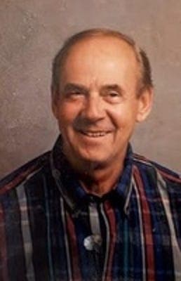 Portrait published with the obituary on azcentral.com/The Arizona Republic showing an older man smiling; used with the life story and services notice.