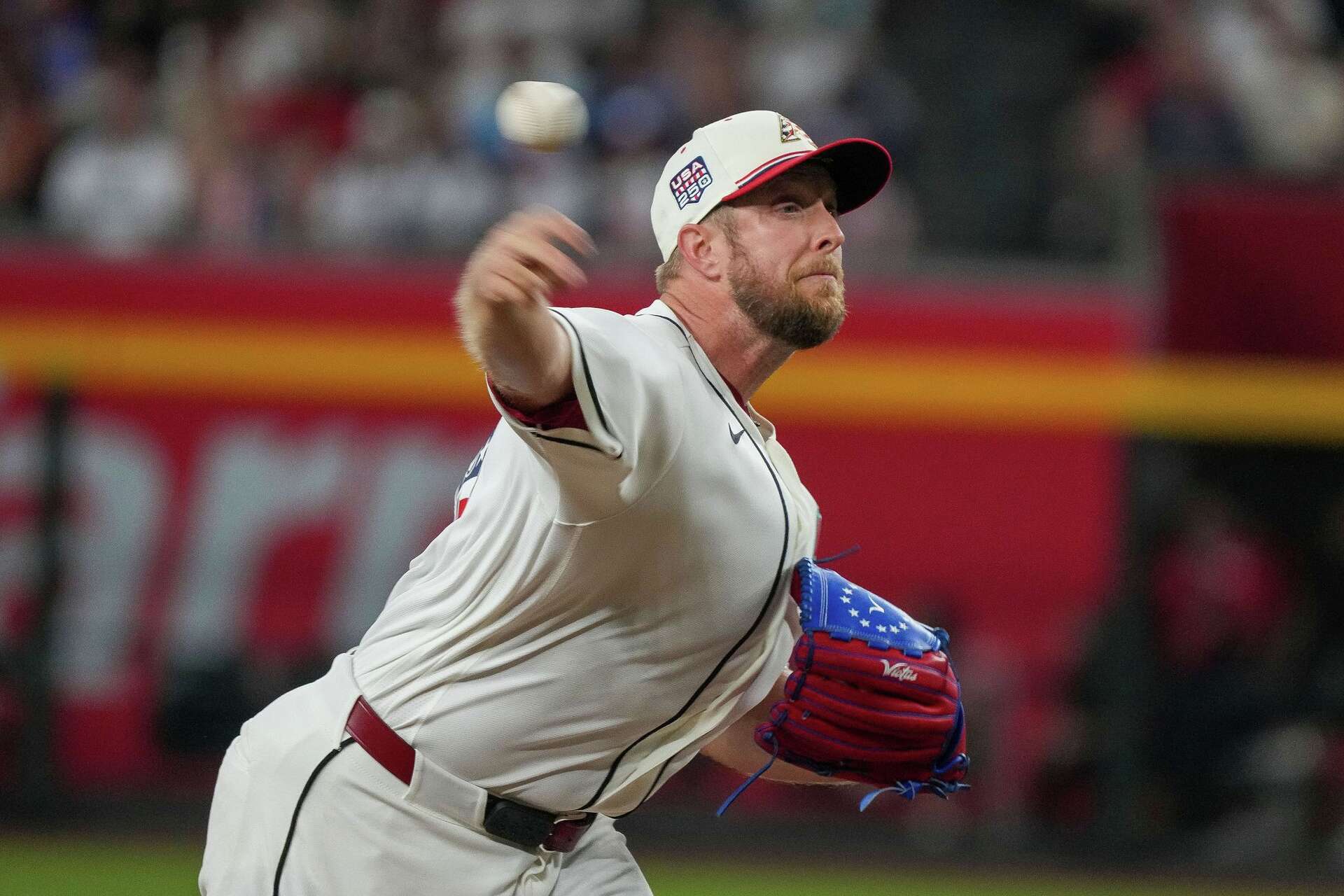 A Diamondbacks pitcher releases a pitch during the July 4 game at Chase Field; Arizona's Merrill Kelly earned the win in the 4-3 victory over Milwaukee.