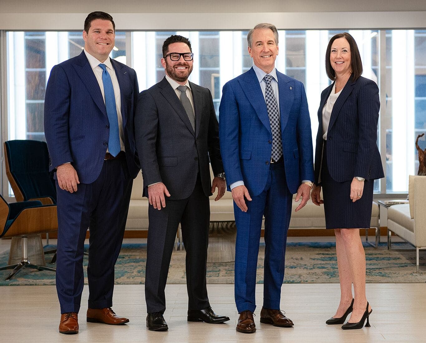Law‑firm leadership posed in an office — representative of the professional workplaces highlighted in AZ Big Media’s '100 Best Places to Work and Live in Arizona for 2026.'