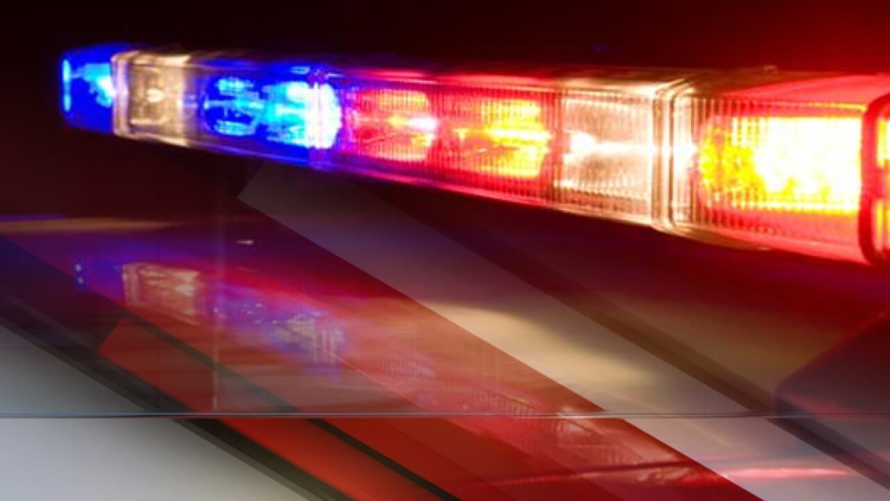 Flashing emergency lights on a patrol vehicle; Tucson police and emergency crews responded to the early‑morning fatal crash at Davis‑Monthan AFB.
