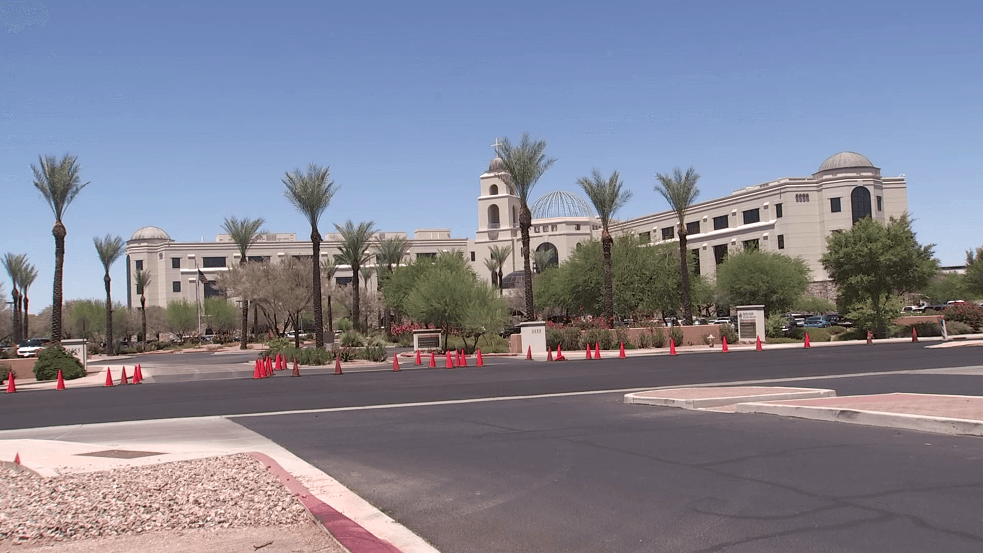 Exterior of a Mesa-area office complex with desert landscaping and palm trees — shown in coverage of Cyber Dive as the company faces a federal wire-fraud investigation.