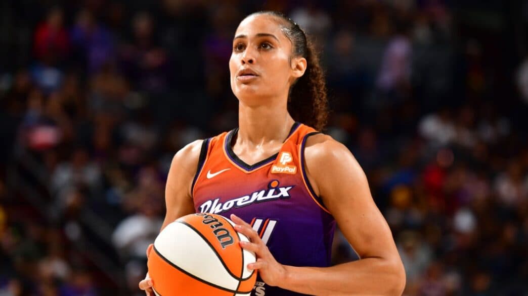 Phoenix Mercury player holds the ball during game action; Phoenix looks to cover as the home underdog against the New York Liberty on Aug. 1.