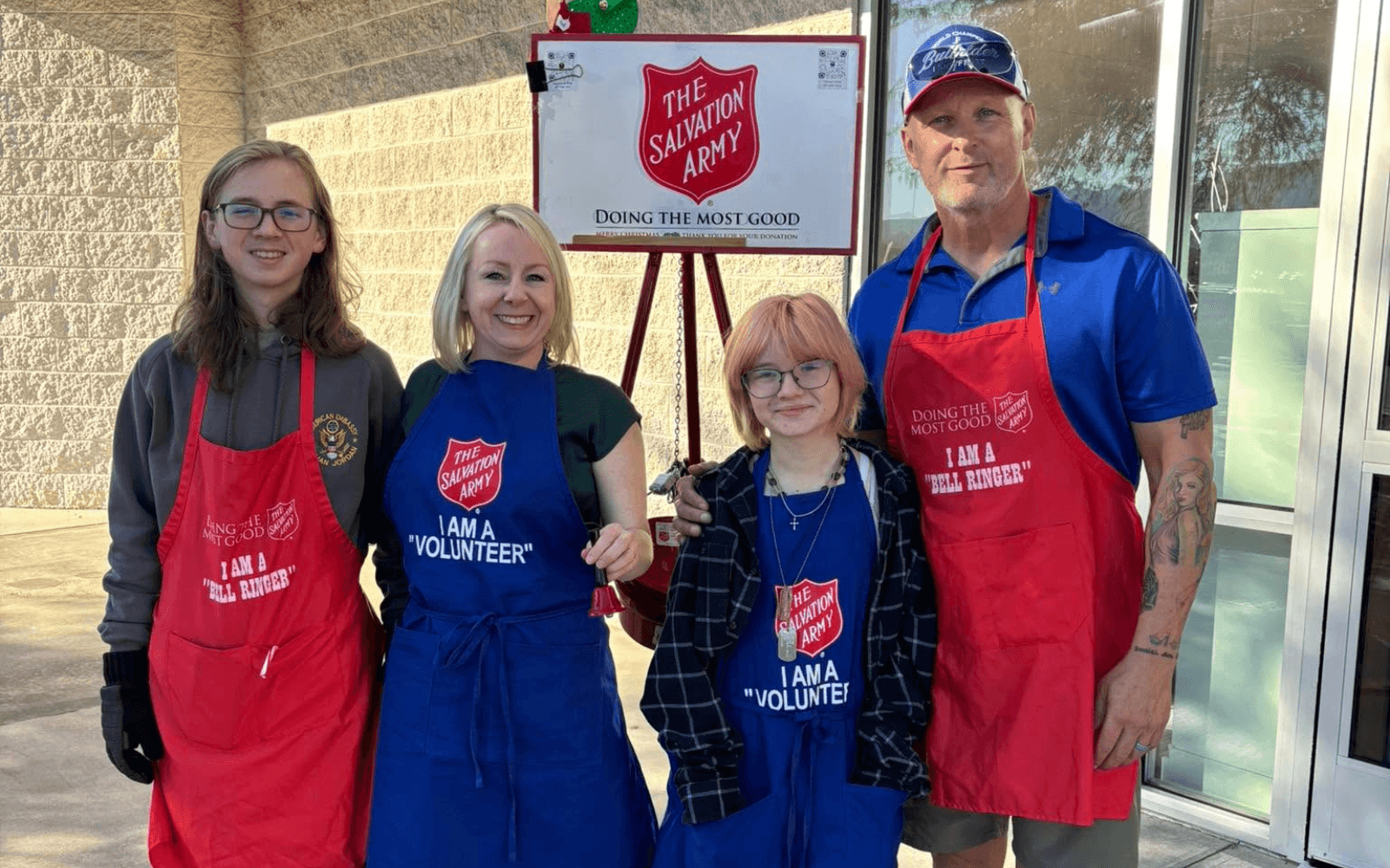 Volunteers ring bells for the Salvation Army outside a Sierra Vista business; community service and local ties are central themes in the vice mayor's mayoral campaign.