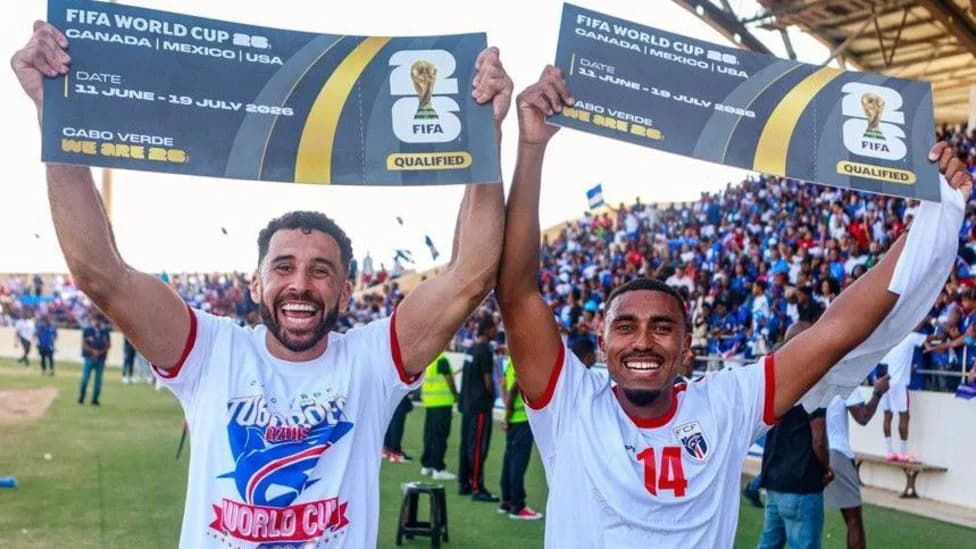 Cabo Verde players hold FIFA World Cup banners and celebrate with fans — a reminder of the island nation's rise heading into their shock draw with Spain.