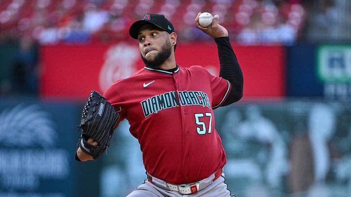 Arizona Diamondbacks pitcher delivering a pitch in the team's red uniform — another D-backs player added to the 2026 All‑Star roster.