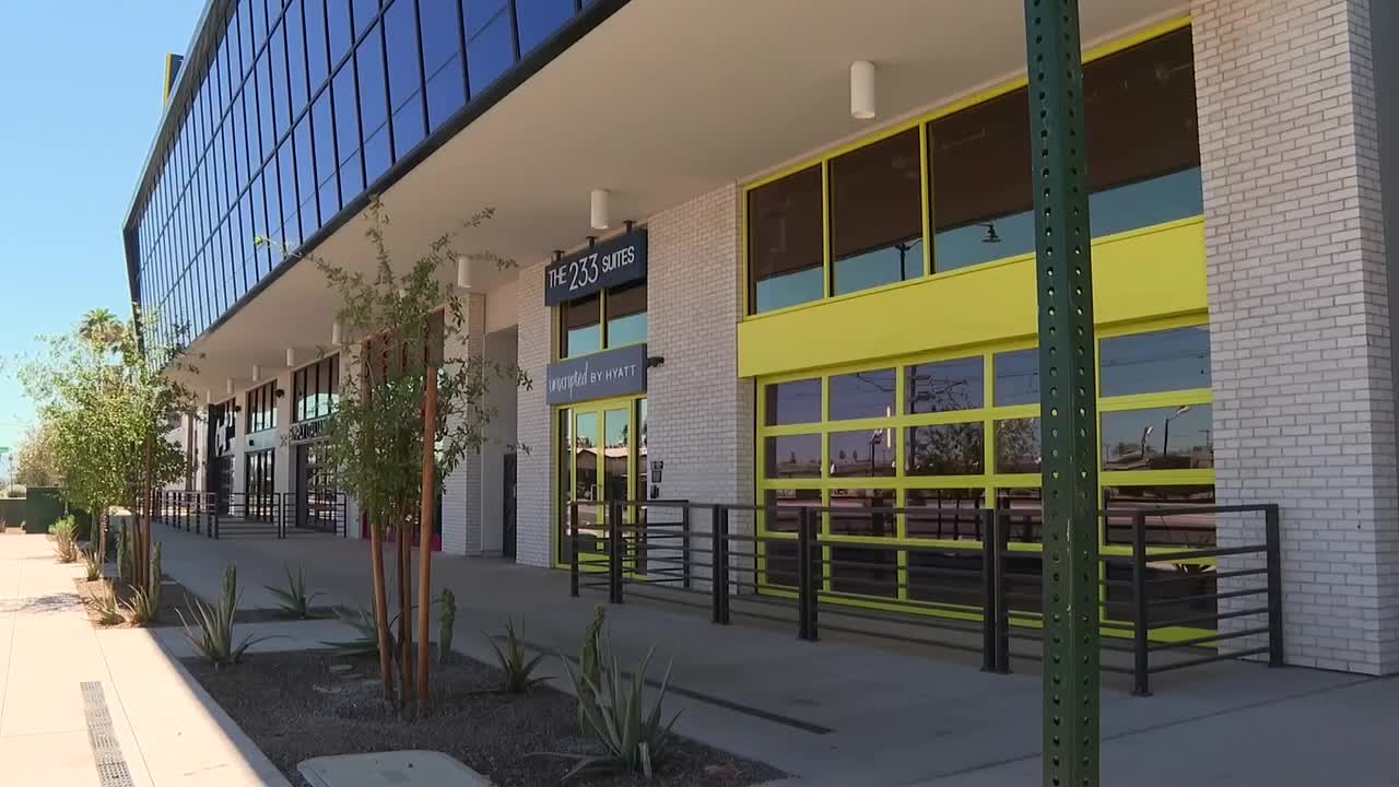 Exterior of The 233 Suites on a downtown Mesa street — part of redevelopment aimed at adding four‑star lodging and supporting convention growth.