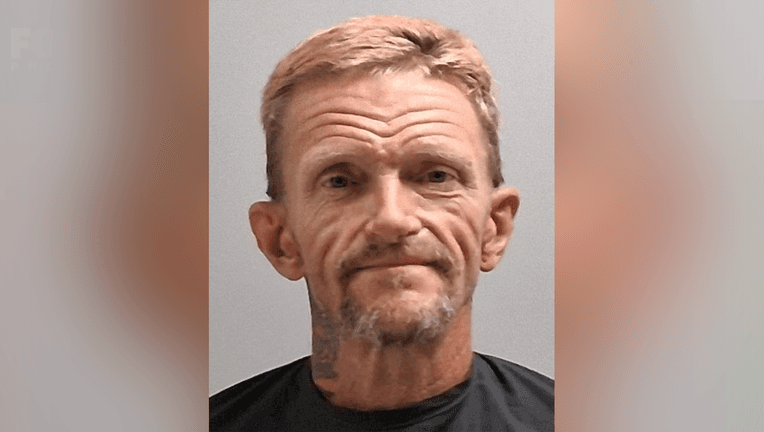 Booking photo released by Cochise County authorities of the 52-year-old man arrested on a murder charge after a body was found near a homeless camp on July 12.