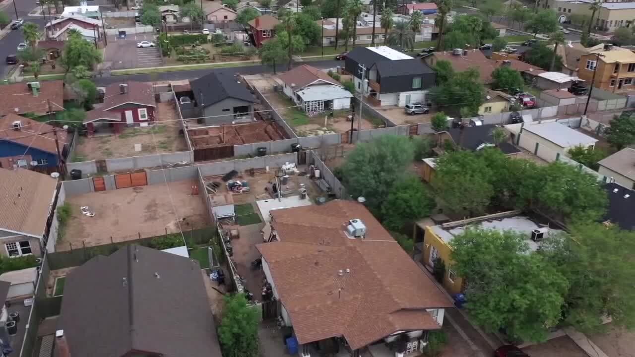 Aerial view of residential properties near 36th Street and Thomas Road in Phoenix, where police are investigating a deadly home-invasion shooting.
