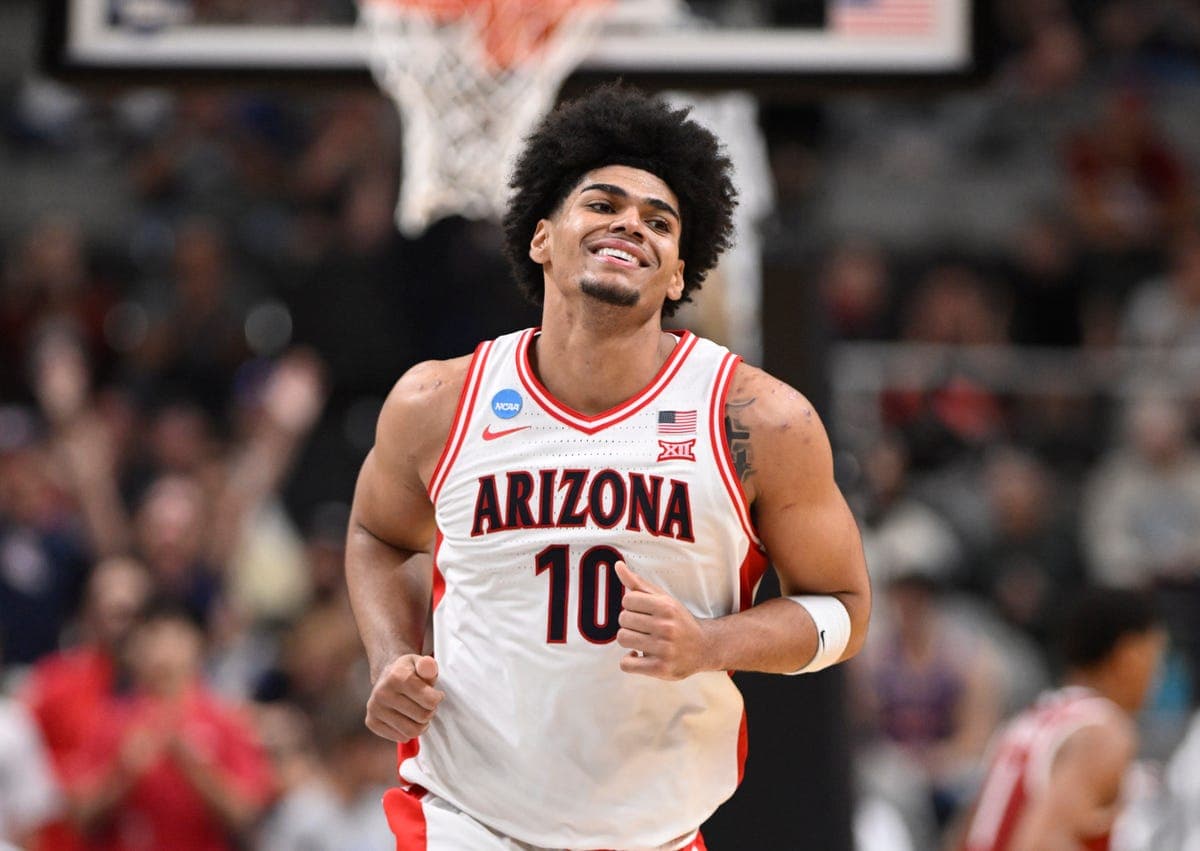 Peat wearing Arizona’s No. 10 celebrates on the court during a Wildcats game — the local product whose college play led to the Suns drafting him.