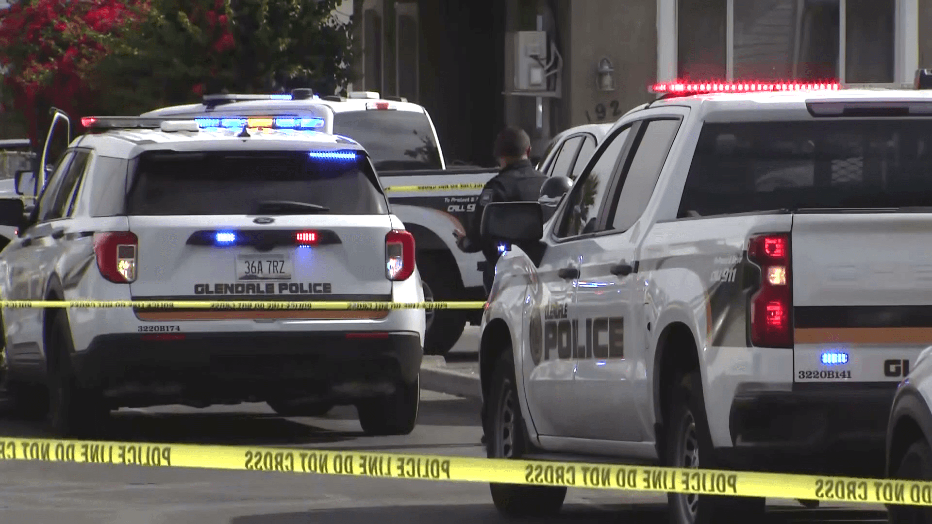 Glendale police vehicles and crime-scene tape at a residential street where officers responded — one of several Valley scenes tied to recent Phoenix-area murder-suicides.