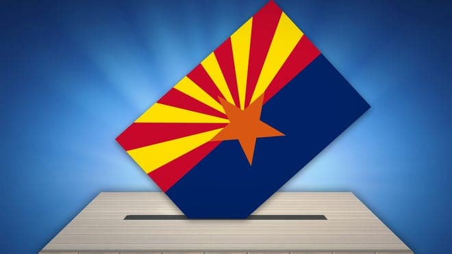 A ballot emblazoned with the Arizona flag is shown being cast — voters’ ballots in the July 21, 2026 primary are being tallied as live results are reported.
