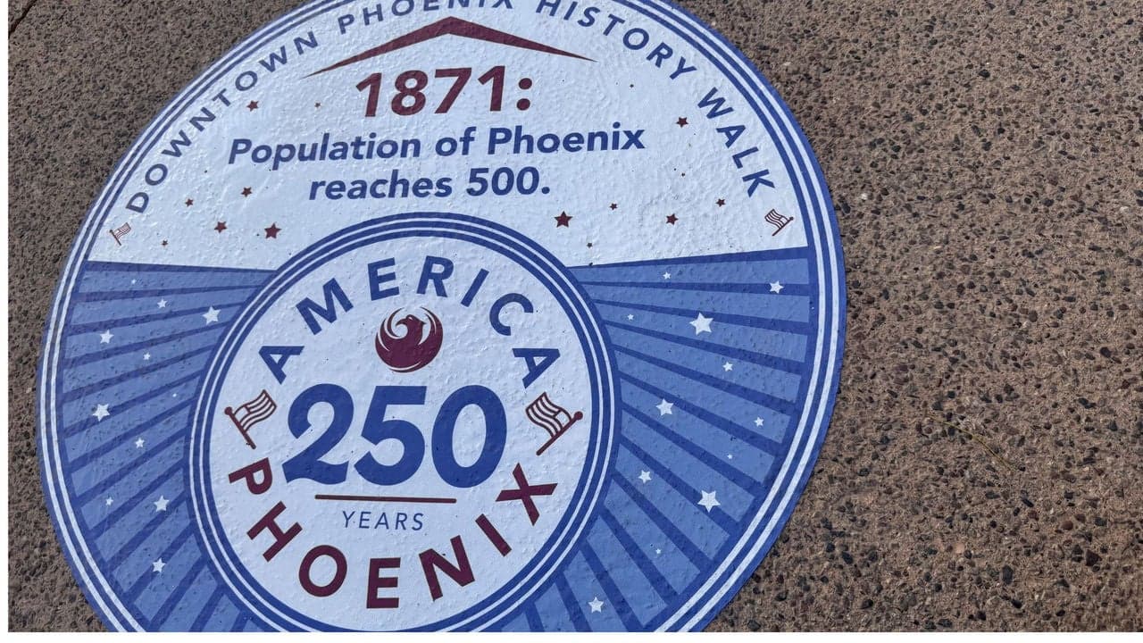 A Downtown Phoenix History Walk ground marker for America250 reads “1871: Population of Phoenix reaches 500,” part of the city’s new interactive history walk.