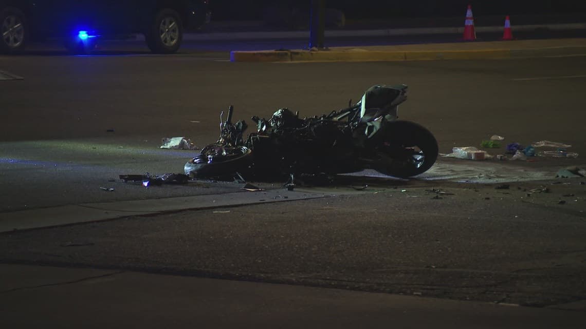Wrecked motorcycle lies in the roadway after an early-morning crash that closed the southbound Loop 101 to eastbound Loop 202 transition ramp.