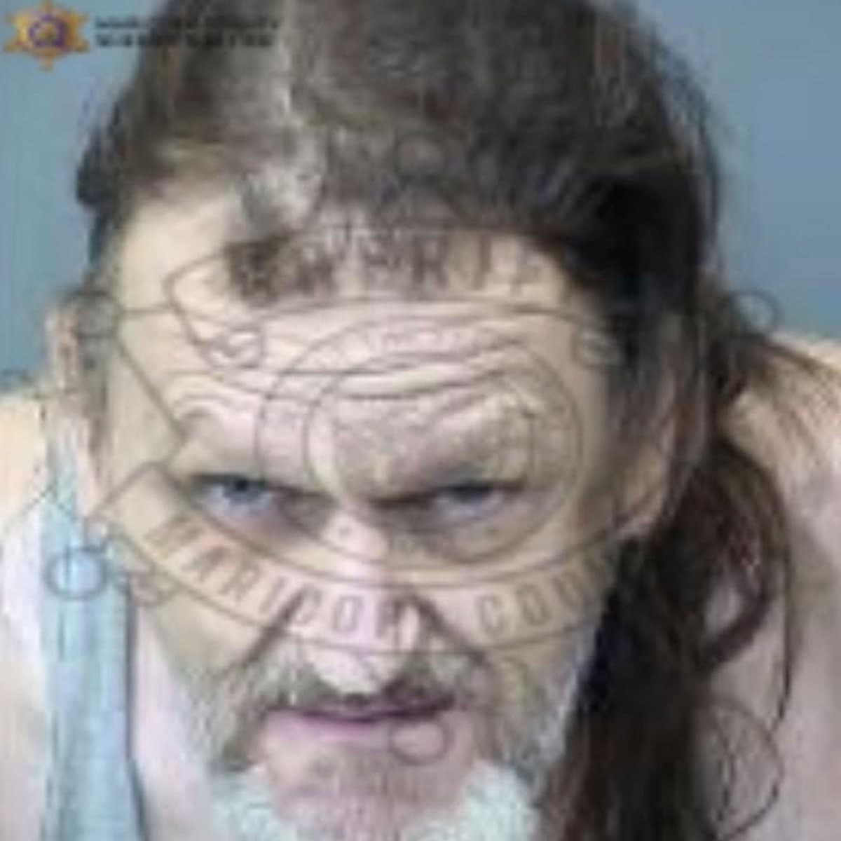Booking photo released by the sheriff’s office of the 52-year-old man accused of leaving his disabled adult son in a bathtub, shown with the agency watermark.