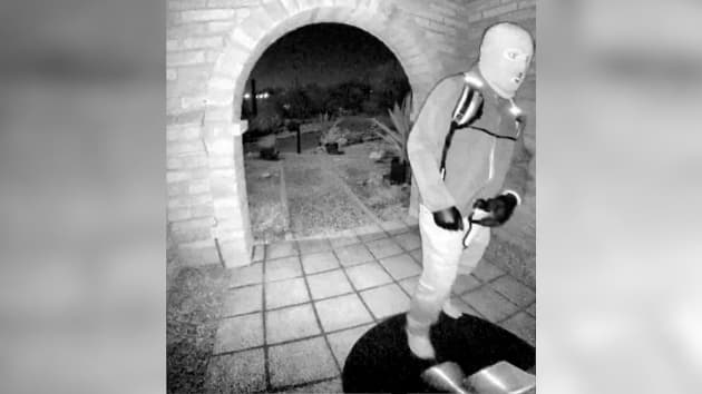 Doorbell-camera still showing a masked person on the front porch of the Tucson residence, released as investigators treat the disappearance as a possible kidnapping.