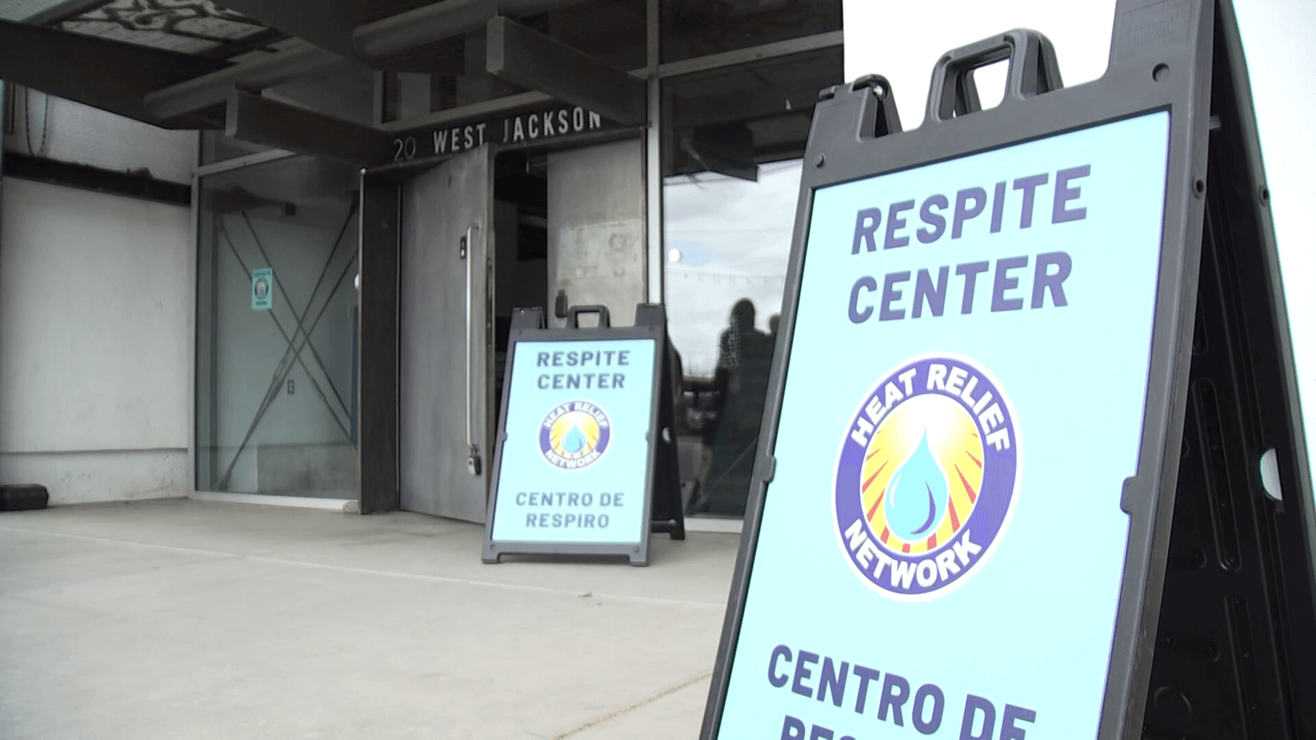 A‑frame signs mark a Respite Center entrance as part of the Heat Relief Network, providing cool refuge during extreme summer temperatures in the Phoenix area.