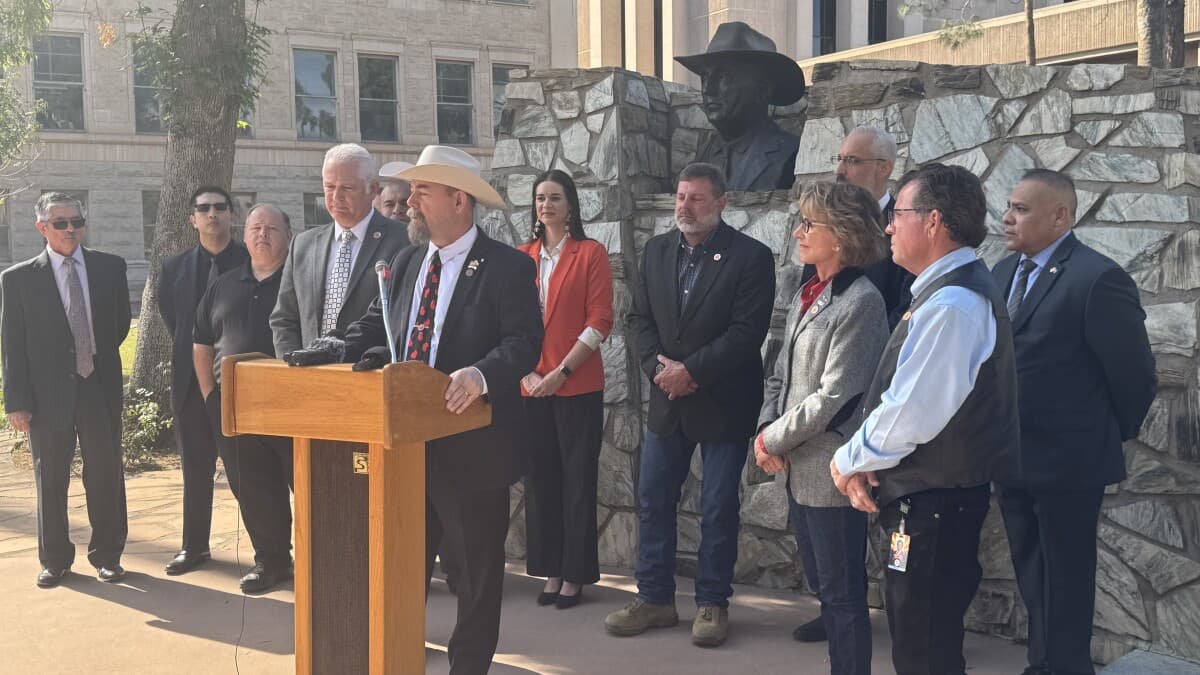 State lawmakers and veterans speak at an outdoor press conference in Arizona promoting expanded property tax relief for disabled veterans after the passage of HB 4168.