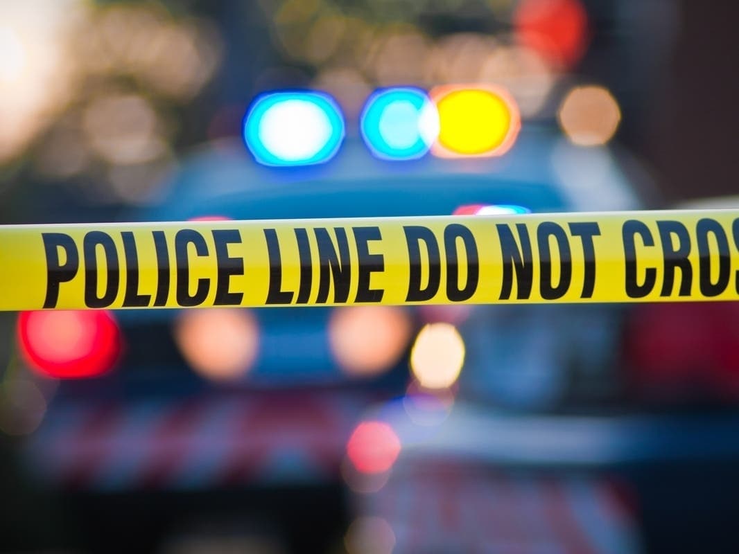 Police tape at a crash scene in Phoenix following a fatal West Phoenix semi-truck collision, authorities say.