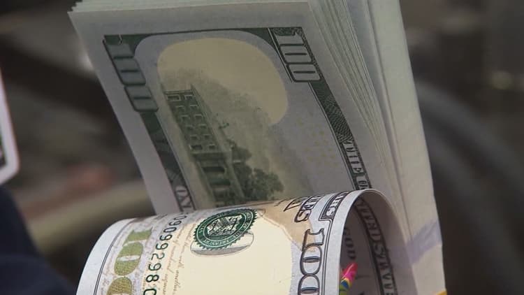 A stack of $100 bills, illustrating the $655,000 prosecutors say a former Mesa bank manager embezzled.