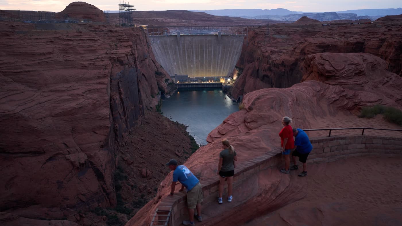 Visitors overlook a major Colorado River dam and reservoir — scenes like this underscore why Phoenix says it is preparing legal action over post‑2026 water allocation plans.
