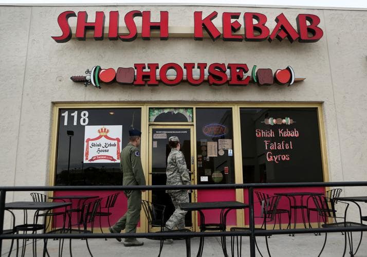 The Shish Kebab House storefront in Tucson with its prominent signage as customers enter, showing the small, family-owned restaurant highlighted in the story about higher produce and delivery prices tied to the Iran war.