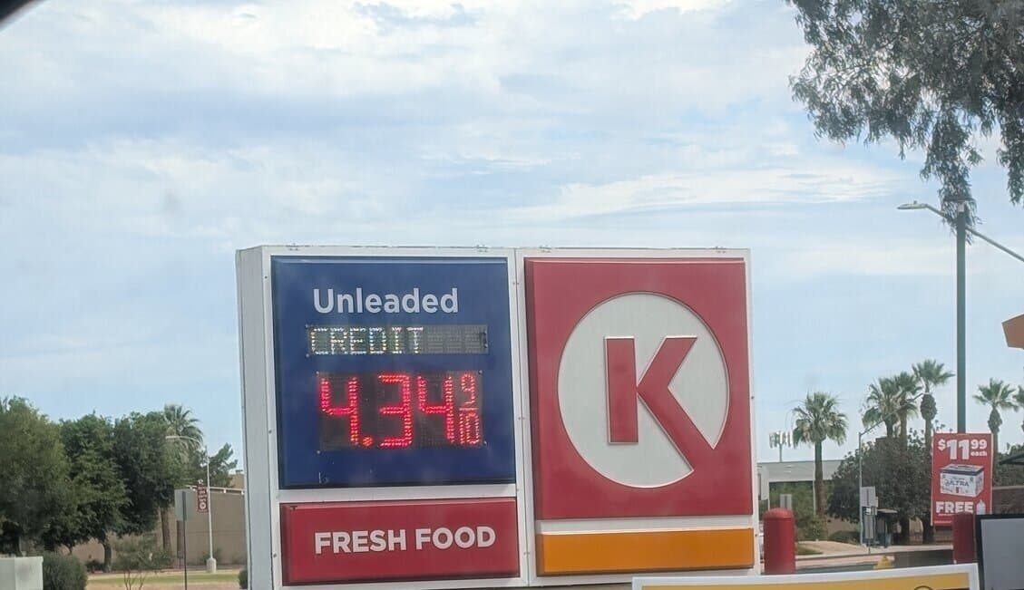A Circle K gas-station sign in Tempe displays regular unleaded at $4.34 per gallon as local prices trend down ahead of July Fourth travel.