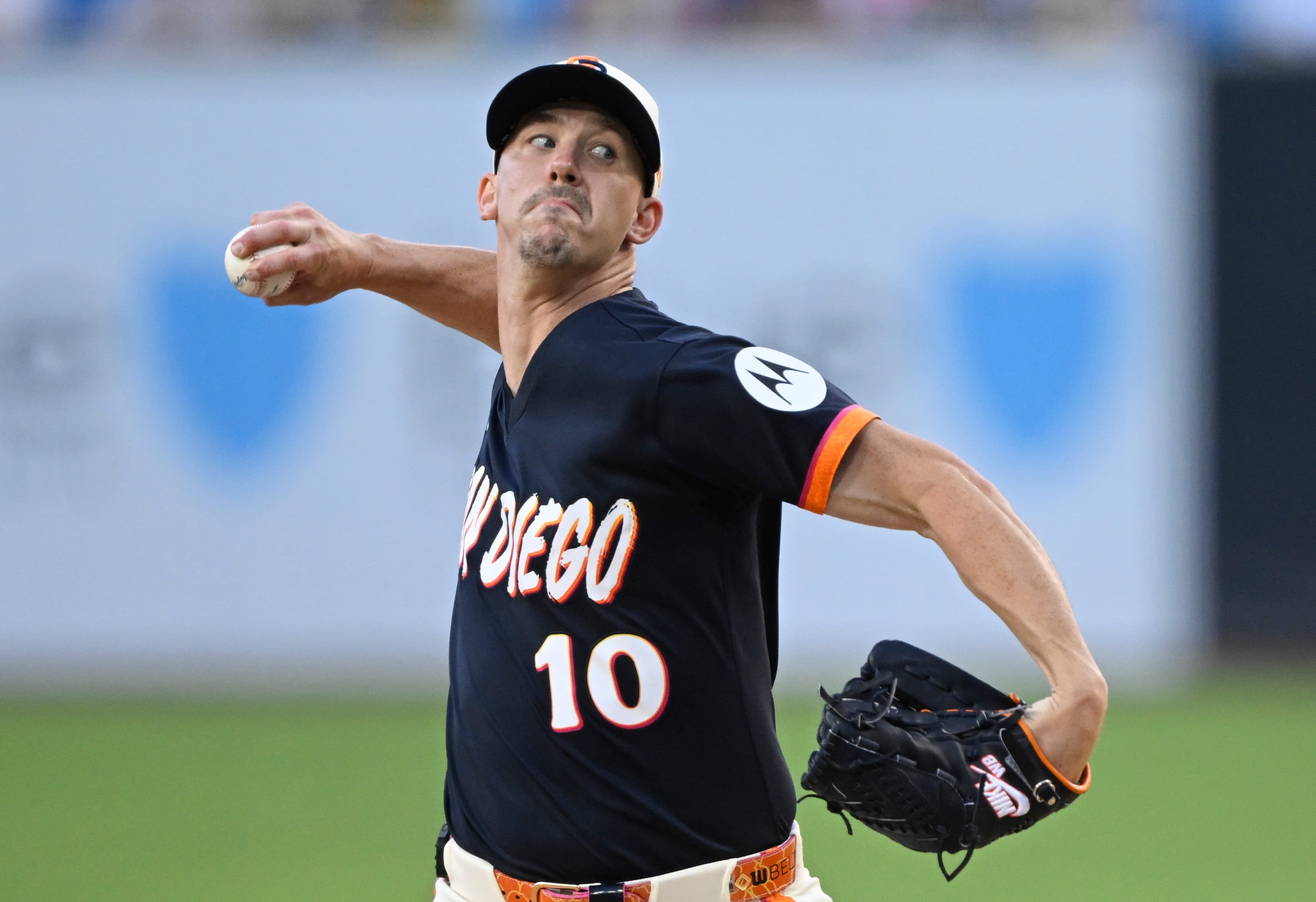 Shows: San Diego Padres pitcher delivering a pitch at Petco Park, representing the home rotation Arizona will face in the Game 1 matchup.
