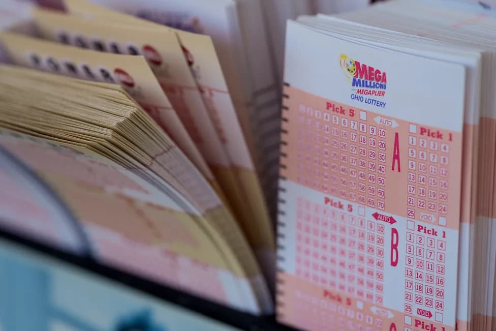 Lottery play slips, including Mega Millions forms, are displayed at a retail location — Arizona players are urged to check their Pick 3 Evening and Fantasy 5 tickets for the July 5, 2026 drawing.