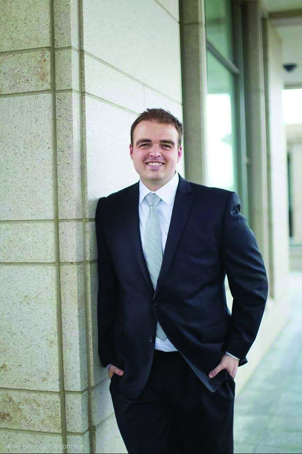 The Mesa entrepreneur behind the fan-focused startup poses outside a building; portrait used to illustrate the article about his company.