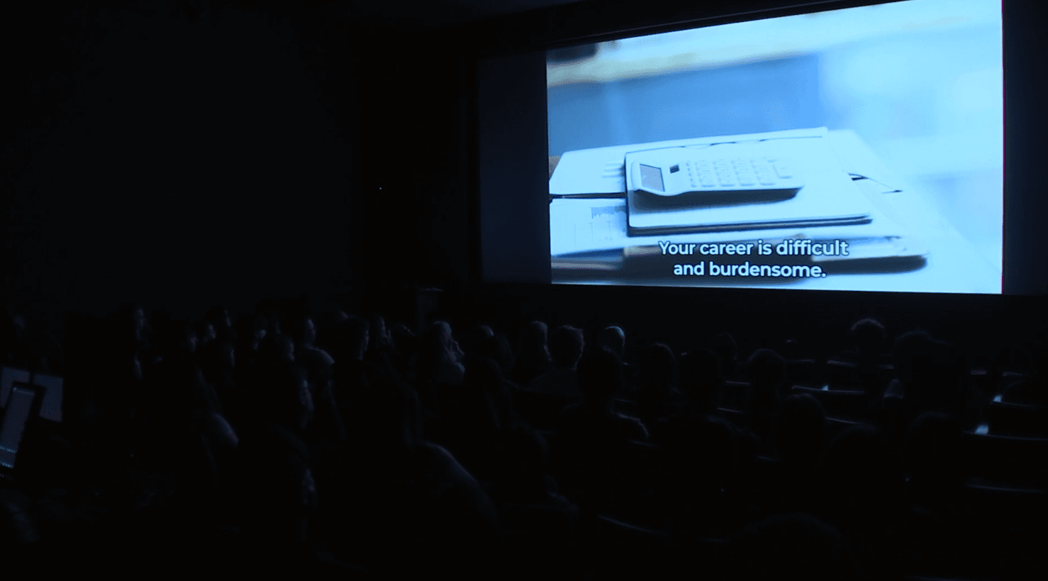 Audience members watch a screening during the LIT Ink: Picture This Showcase, the Mesa Arts Center event where students present work created in the poetry program.
