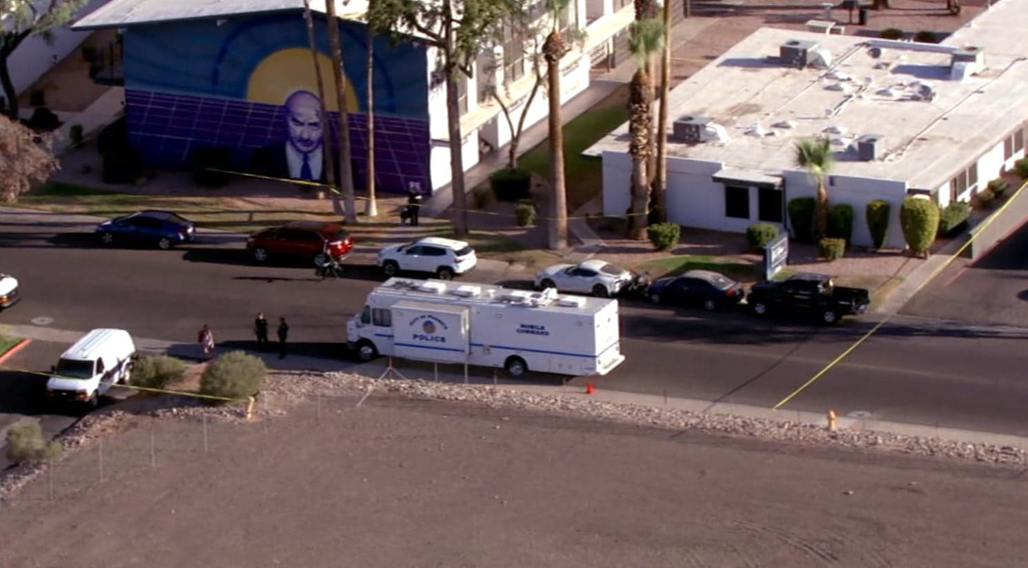 Police mobile command vehicle and crime-scene tape outside the midtown Phoenix apartment complex where one person was killed overnight at 16th St. and Missouri.