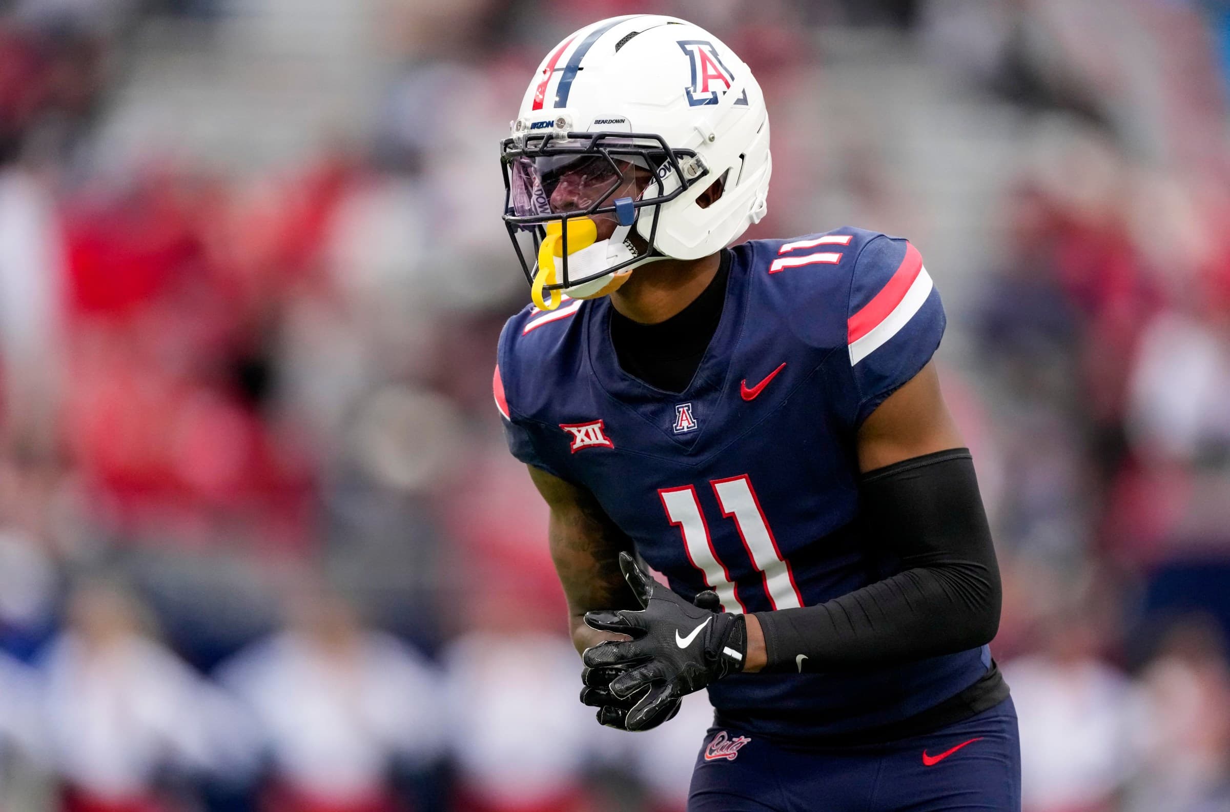 Arizona Wildcats player in game-day uniform during a recent matchup, illustrating the team's on-field look ahead of Big 12 Media Days and the Tristan Bounds feature.