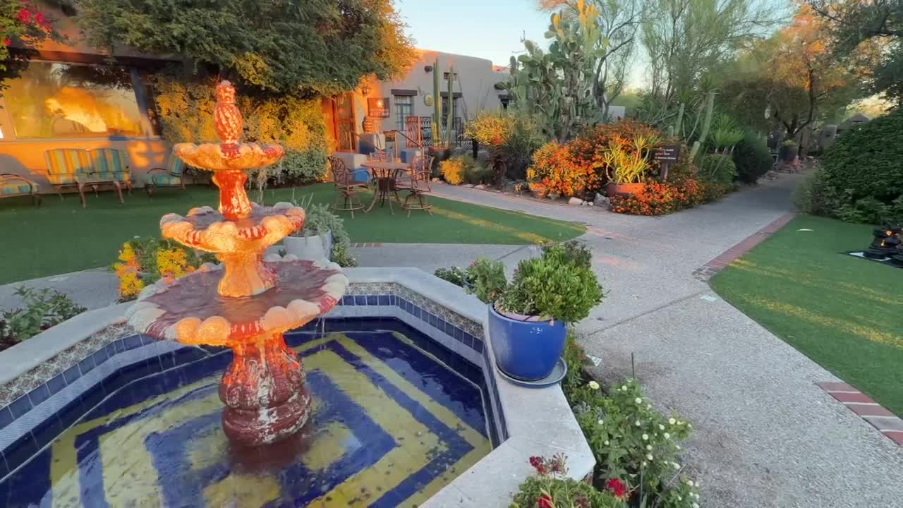 The resort's courtyard at Hacienda Del Sol with a tiled fountain, desert plantings and seating, illustrating the property's evolution into a world‑class resort.