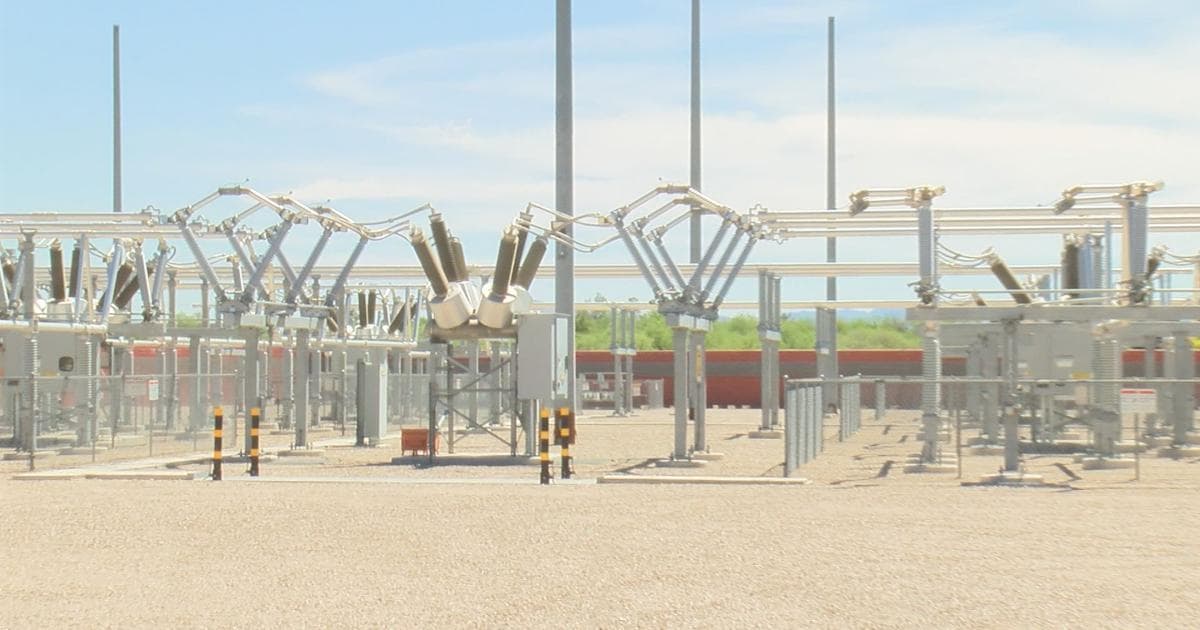 Tucson Electric Power substation showing high‑voltage switching equipment and lines used to distribute electricity as the utility prepares for increased demand during extreme heat.