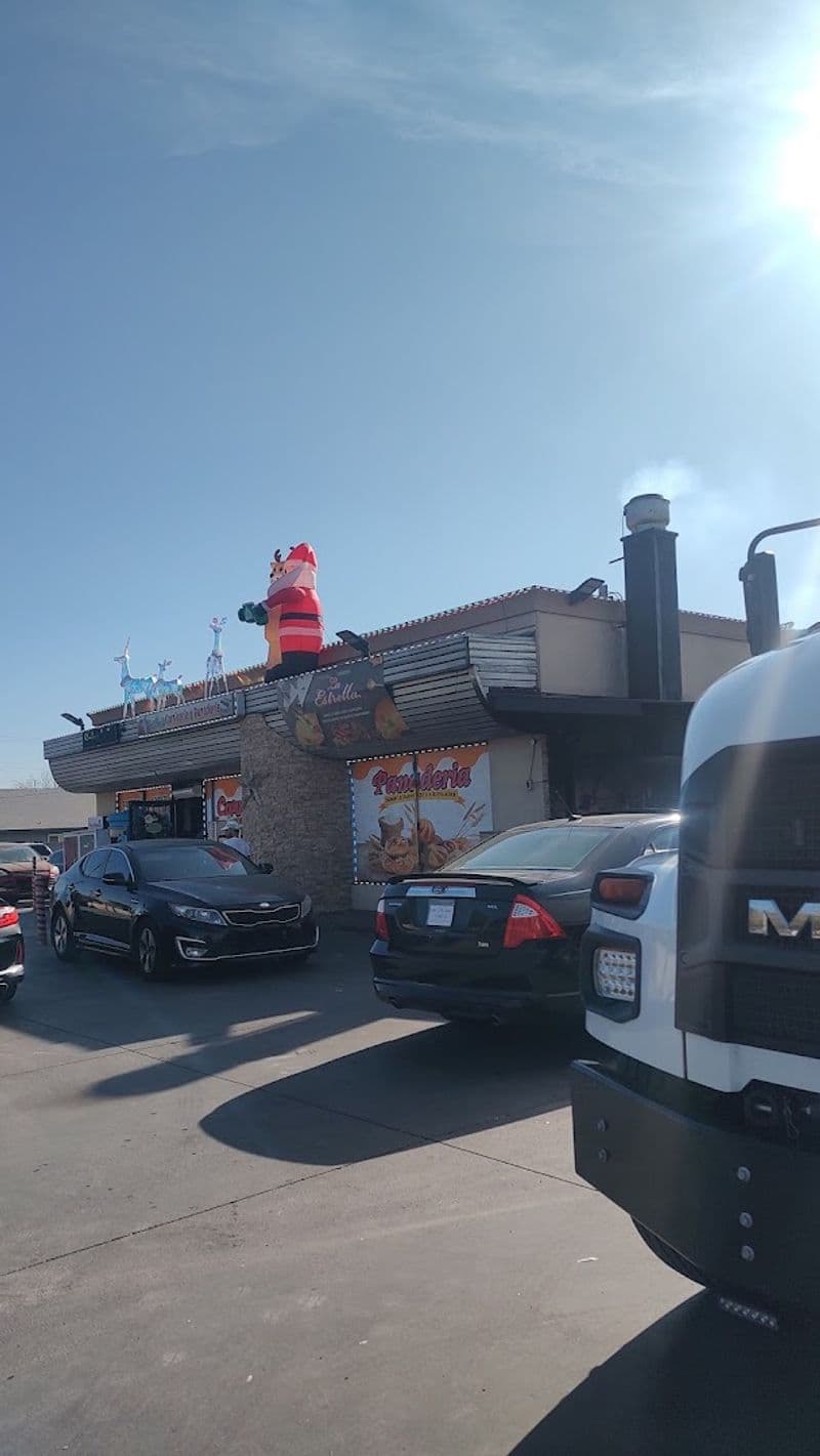 Exterior of the Mesa panadería with 'Panadería' signage and holiday decor — the tiny Mexican bakeshop profiled in Fast Food Club's 2026 roundup for serving some of Arizona’s best tamales.