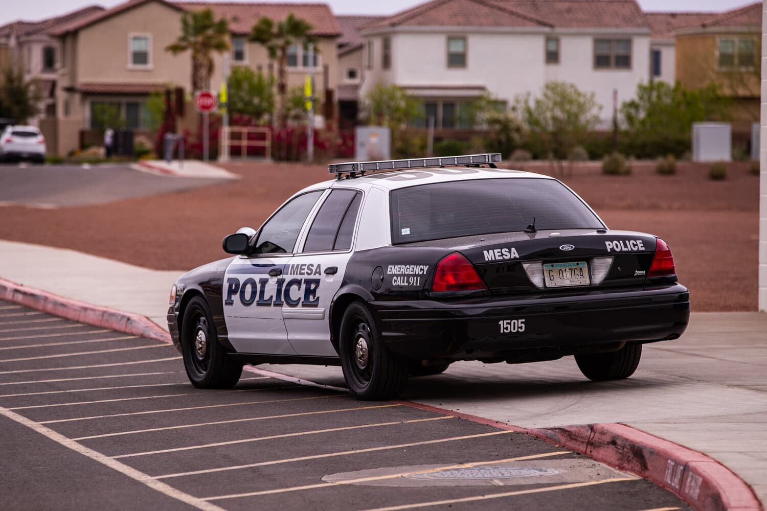 A Mesa Police patrol car parked in a residential neighborhood in Mesa, Ariz.; a Mesa officer and his wife are suing a former therapist, alleging the therapist initiated an improper intimate relationship.