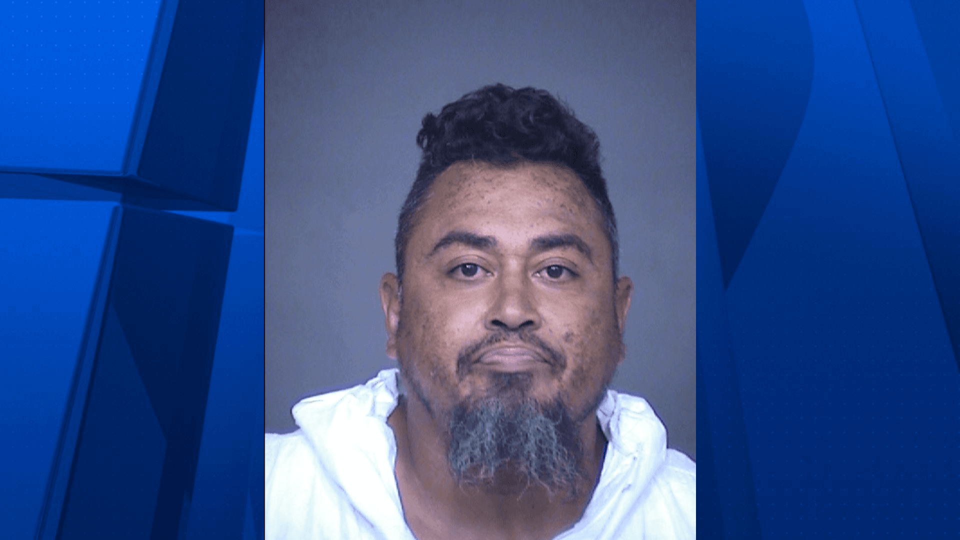 Mugshot of an individual arrested in the Mesa fatal stabbing; police say the victim had multiple stab wounds and died at the scene.