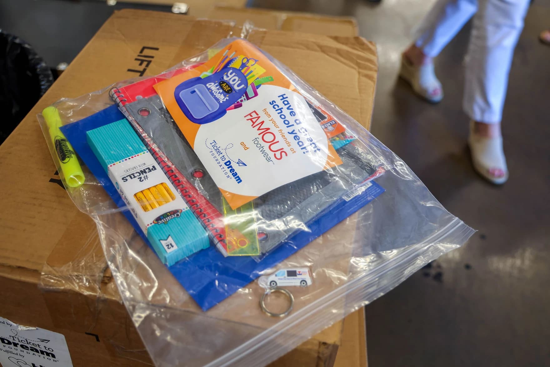 A prepackaged bag of free school supplies — pencils, notebooks, a highlighter and informational flyer — at a back-to-school giveaway in metro Phoenix.