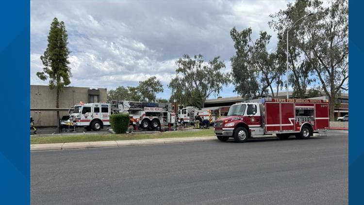 Mesa and Chandler fire units parked outside the apartment complex on Lindner Ave after fireworks ignited a roof fire that displaced two residents.