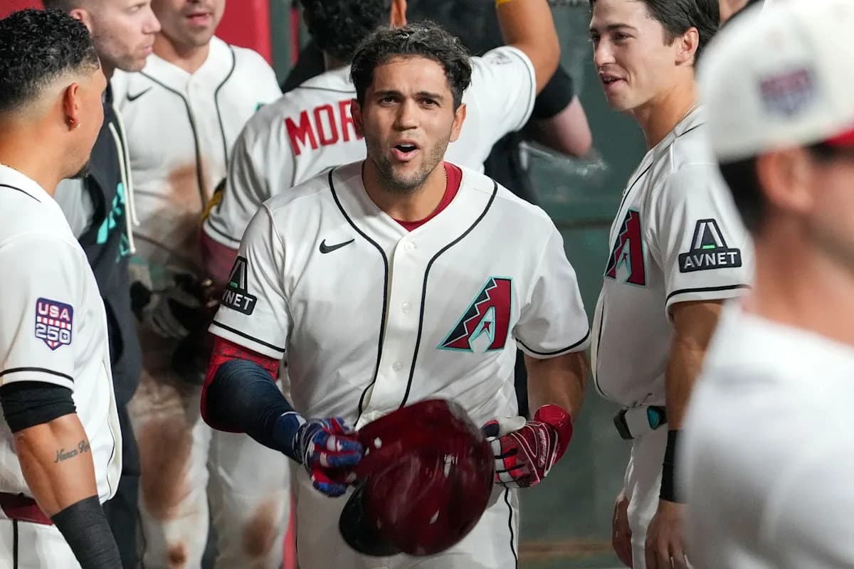 Arizona Diamondbacks players celebrate in the dugout after a first‑inning three‑run home run that helped lift Arizona to a 4-3 win over the Milwaukee Brewers at Chase Field.
