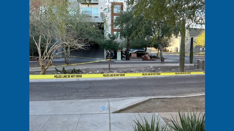 A cordoned-off area with police tape outside a building near 9th Street and Indian School Road in central Phoenix as detectives investigate the scene.