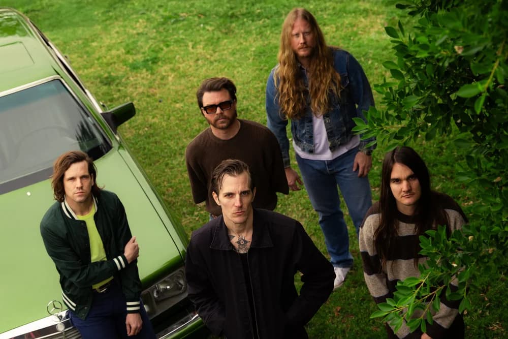 Promotional portrait of the festival’s five-member headlining band, used in the 8123 Fest announcement.