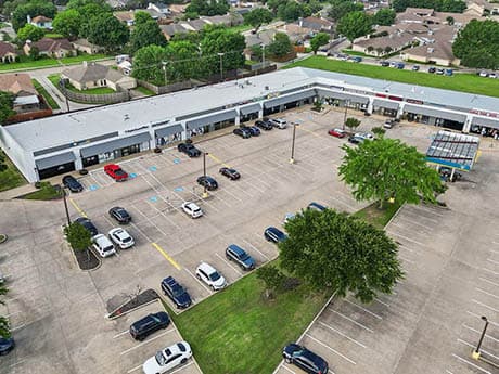 Aerial view of the Metro Phoenix power center showing a linear strip of retail and surface parking; Gantry arranged a $38 million refinancing for the 224,000-square-foot property.