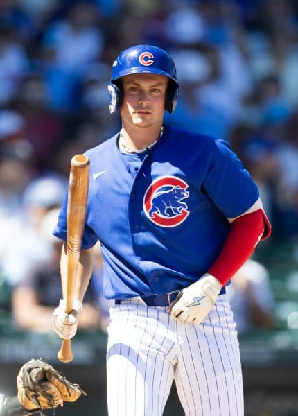 The 19-year-old phenom walks with his bat between at-bats in a Cubs jersey, a quieter portrait from the same game.