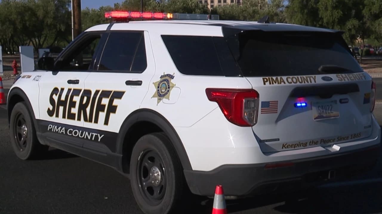 Pima County Sheriff vehicle at the scene as deputies respond to a motorcycle crash near Valencia and Cardinal that left the rider dead and a passenger injured.