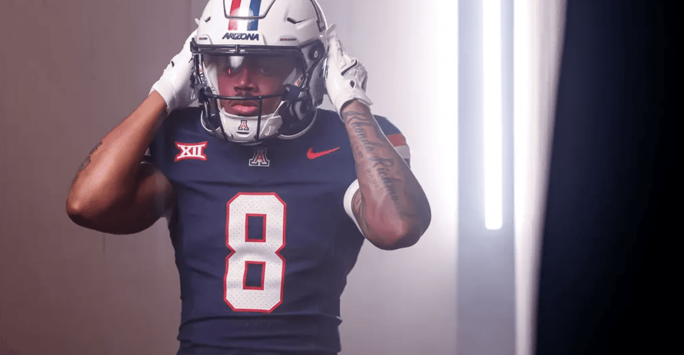 An Arizona player in full uniform during a studio shoot — a visual representing the offensive continuity the Wildcats return as they head into the 2026 season.